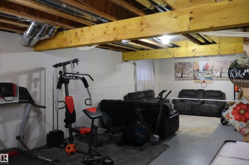 Workout room with finished concrete flooring - 9760 - 107 Street, Westlock, AB - Indoor Photo Showing Basement