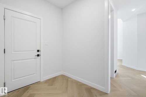 Interior space featuring parquet floors and recessed lighting - 17108 2 Street, Edmonton, AB - Indoor Photo Showing Other Room