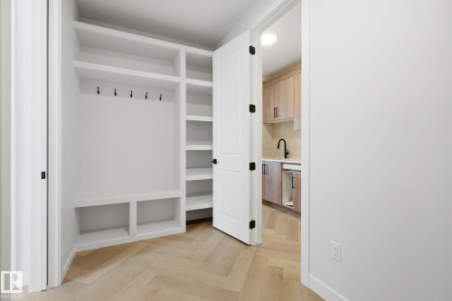 Mudroom featuring parquet flooring and a sink - 17108 2 Street, Edmonton, AB - Indoor