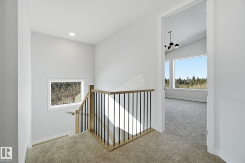 Hallway with carpet flooring, recessed lighting, and vaulted ceiling - 17108 2 Street, Edmonton, AB - Indoor Photo Showing Other Room