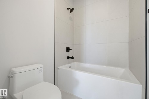 Bathroom with toilet and shower / bath combination - 17108 2 Street, Edmonton, AB - Indoor Photo Showing Bathroom