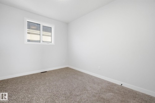 Spare room featuring baseboards and carpet flooring - 17108 2 Street, Edmonton, AB - Indoor Photo Showing Other Room