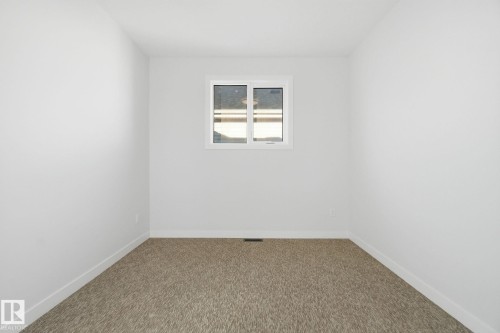 Unfurnished room featuring baseboards and carpet flooring - 17108 2 Street, Edmonton, AB - Indoor Photo Showing Other Room