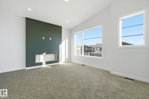 Carpeted spare room featuring vaulted ceiling and recessed lighting - 17108 2 Street, Edmonton, AB - Indoor Photo Showing Other Room