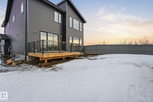 Snow covered rear of property with a deck - 17108 2 Street, Edmonton, AB - Outdoor