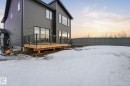 Snow covered rear of property with a deck - 17108 2 Street, Edmonton, AB  - Outdoor 