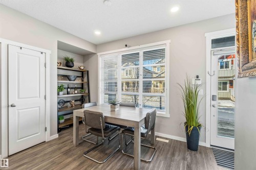 Dining space featuring dark wood-style floors and recessed lighting - 1908 25 Street, Edmonton, AB - Indoor Photo Showing Dining Room