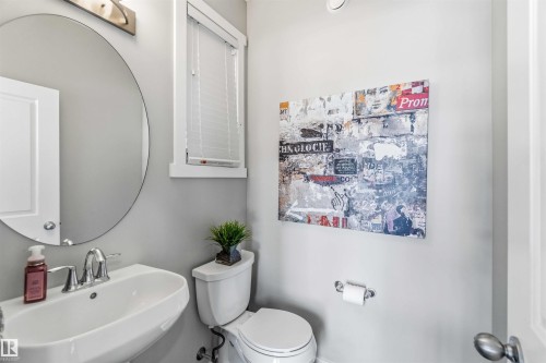 Half bath with toilet and a sink - 1908 25 Street, Edmonton, AB - Indoor Photo Showing Bathroom