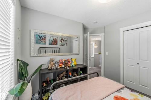 Bedroom featuring a textured ceiling and a closet - 1908 25 Street, Edmonton, AB - Indoor