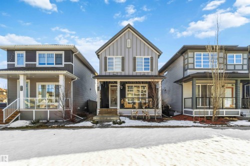 View of front facade featuring covered porch and board and batten siding - 1908 25 Street, Edmonton, AB - Outdoor With Deck Patio Veranda With Facade