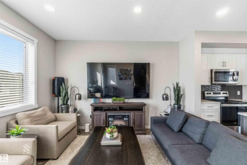 Living room featuring a textured ceiling and recessed lighting - 1908 25 Street, Edmonton, AB - Indoor Photo Showing Living Room
