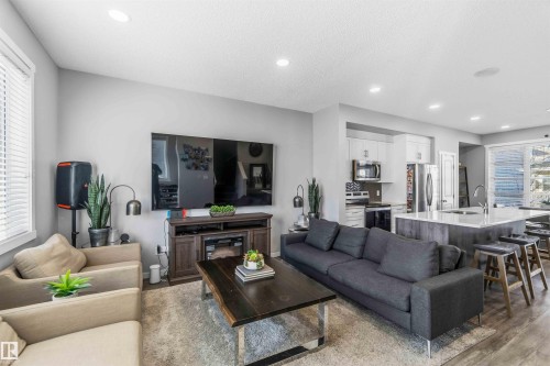 Living area with recessed lighting and light wood-style floors - 1908 25 Street, Edmonton, AB - Indoor Photo Showing Living Room