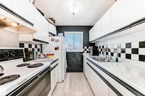 347 10520 120 Street, Edmonton, AB - Indoor Photo Showing Kitchen With Double Sink