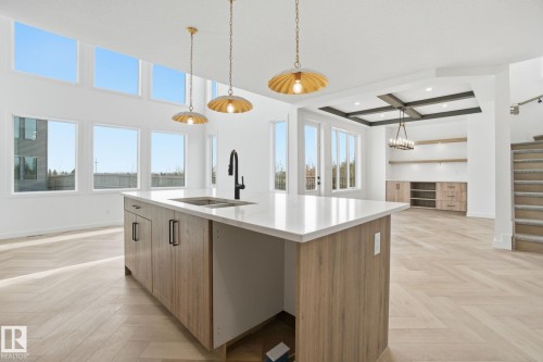 Kitchen with parquet floors, hanging light fixtures, wood finish cabinetry, and coffered ceiling - 17107 3 Street, Edmonton, AB - Indoor Photo Showing Kitchen With Double Sink With Upgraded Kitchen