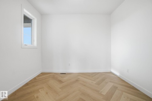 Empty room with parquet flooring - 17107 3 Street, Edmonton, AB - Indoor Photo Showing Other Room