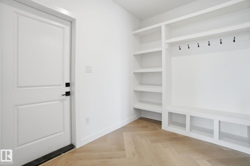 Mudroom featuring parquet floors and baseboards - 17107 3 Street, Edmonton, AB - Indoor