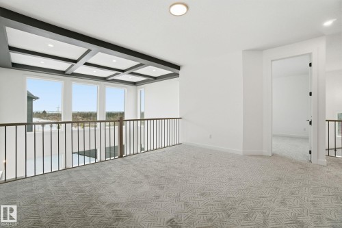 Unfurnished room with coffered ceiling, light colored carpet, and recessed lighting - 17107 3 Street, Edmonton, AB - Indoor Photo Showing Other Room