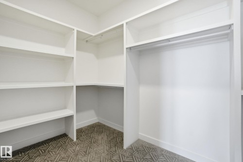 View of walk in closet - 17107 3 Street, Edmonton, AB - Indoor With Storage