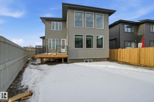 Snow covered house with a fenced backyard and a deck - 17107 3 Street, Edmonton, AB - Outdoor