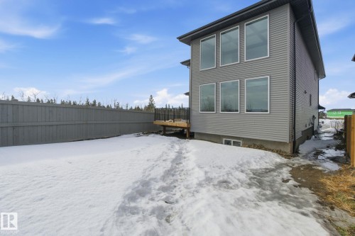 Snow covered rear of property with a wooden deck - 17107 3 Street, Edmonton, AB - Outdoor