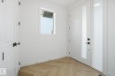 Foyer with parquet flooring and baseboards - 17107 3 Street, Edmonton, AB  - Indoor Photo Showing Other Room 