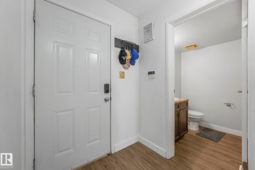 Main Floor Bathroom with vanity and dark wood finished floors - 19 1415 62 Street, Edmonton, AB - Indoor