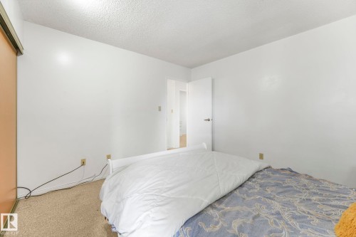 Bedroom featuring a textured ceiling and carpet flooring - 19 1415 62 Street, Edmonton, AB - Indoor Photo Showing Bedroom