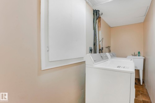 Laundry room with stone finish flooring and washing machine and dryer - 19 1415 62 Street, Edmonton, AB - Indoor Photo Showing Laundry Room