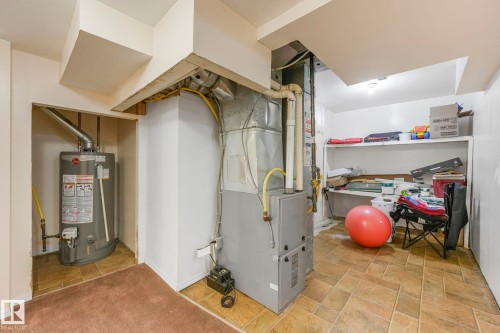 Utility room with water heater and heating unit - 19 1415 62 Street, Edmonton, AB - Indoor