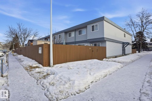 View of snow covered exterior with a gate - 16B 18305 89 Avenue, Edmonton, AB - Outdoor