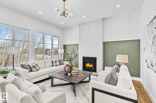 6620 Crawford Landing Landing, Edmonton, AB - Indoor Photo Showing Living Room With Fireplace