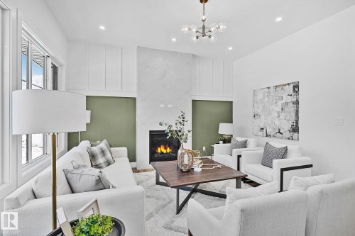 6620 Crawford Landing Landing, Edmonton, AB - Indoor Photo Showing Living Room With Fireplace