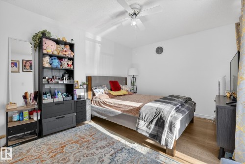 Bedroom with a ceiling fan and wood finished floors - 10602 66 Avenue, Edmonton, AB - Indoor Photo Showing Bedroom