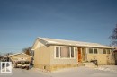 View of front facade featuring a garage and an outbuilding - 5518 51 Ave, St. Paul Town, AB  - Outdoor 