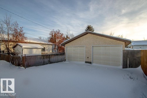 Snow covered garage with a garage - 5130 49 Ave, St. Paul Town, AB - Outdoor With Exterior