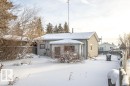 Snow covered back of property featuring stucco siding - 5138 47 Ave, St. Paul Town, AB  - Outdoor 