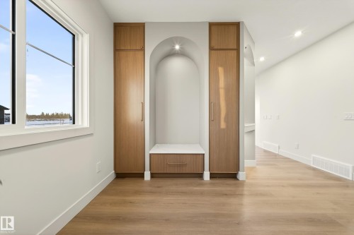 Corridor with light wood-style floors and recessed lighting - 8924 Mayday Way, Edmonton, AB 