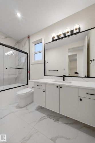Bathroom with vanity and light marble finish floors - 8924 Mayday Way, Edmonton, AB - Indoor Photo Showing Bathroom