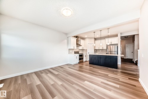 Unfurnished living room with light wood-style floors and recessed lighting - 17926 62A Street, Edmonton, AB - Indoor Photo Showing Kitchen