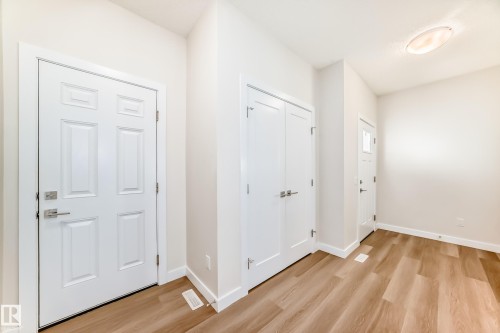 Entryway with light wood-style floors and baseboards - 17926 62A Street, Edmonton, AB - Indoor Photo Showing Other Room