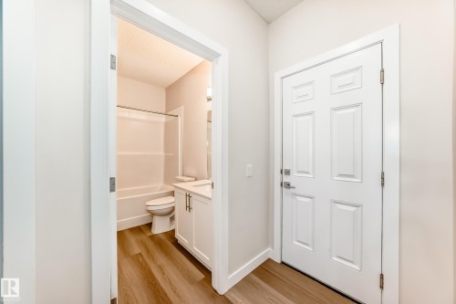 Full bathroom featuring vanity, light wood-type flooring, and shower / washtub combination - 17926 62A Street, Edmonton, AB - Indoor