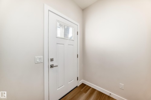 Entryway featuring wood finished floors and baseboards - 17926 62A Street, Edmonton, AB - Indoor Photo Showing Other Room