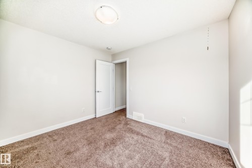 Carpeted spare room with baseboards - 17926 62A Street, Edmonton, AB - Indoor Photo Showing Other Room
