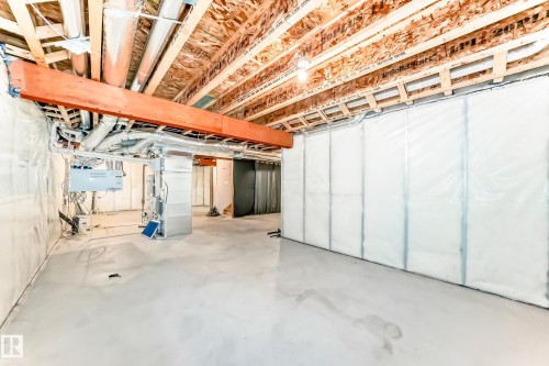 Unfinished below grade area featuring heating unit - 17926 62A Street, Edmonton, AB - Indoor Photo Showing Basement