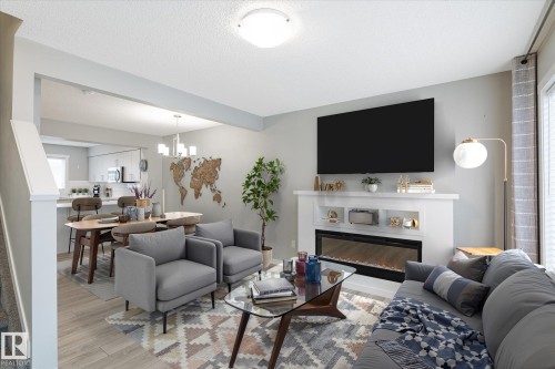 14 1110 Daniels Link Link, Edmonton, AB - Indoor Photo Showing Living Room With Fireplace