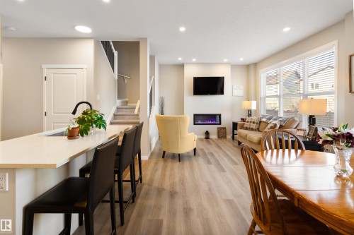 22706 95A Avenue, Edmonton, AB - Indoor Photo Showing Dining Room With Fireplace