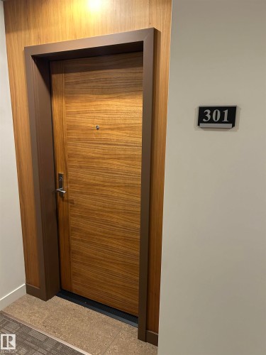 Classy and elegant common areas and Hallways. - 301 625 Leger Way Nw, Edmonton, AB - Indoor Photo Showing Other Room