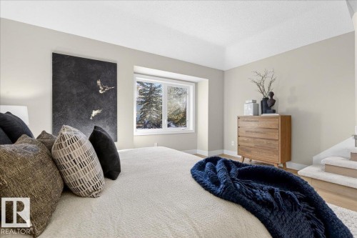 Bedroom featuring baseboards and a textured ceiling - 218 Omand Drive, Edmonton, AB 