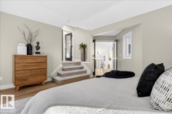 Bedroom with wood finished floors and baseboards - 