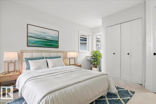 Carpeted bedroom featuring a closet - 218 Omand Drive, Edmonton, AB 